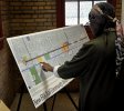 Woman reviewing Englewood New E.R.A. Trail Plan- Photo by Andrew Roddewig of Clarion New Media